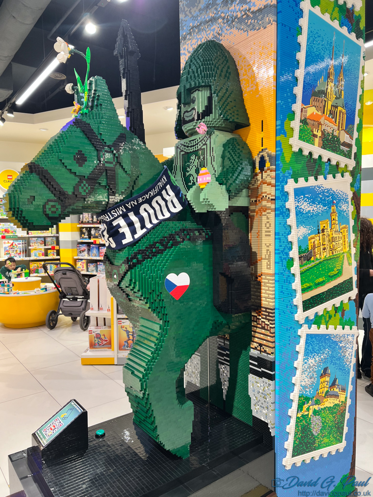 A large green horse and knight made from LEGO bricks