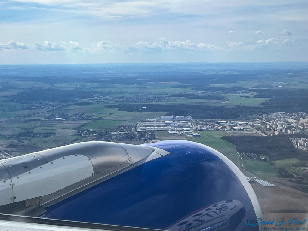 A reflection of an aircraft can be seen in an aircraft jet engine