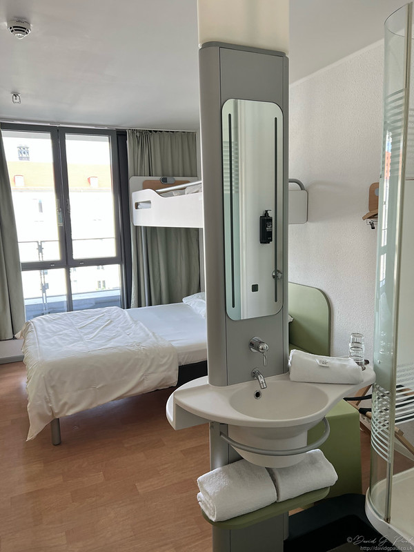 Hotel room with a bunkbed over a double