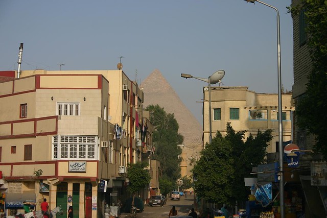 The streets of Giza with the Pyramids behind