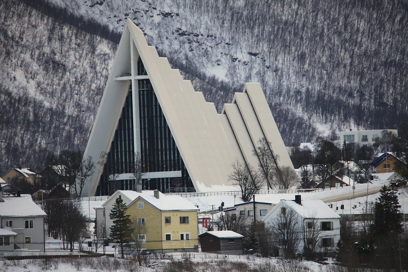 White cathedral shaped like a triangular prism, with a white roof